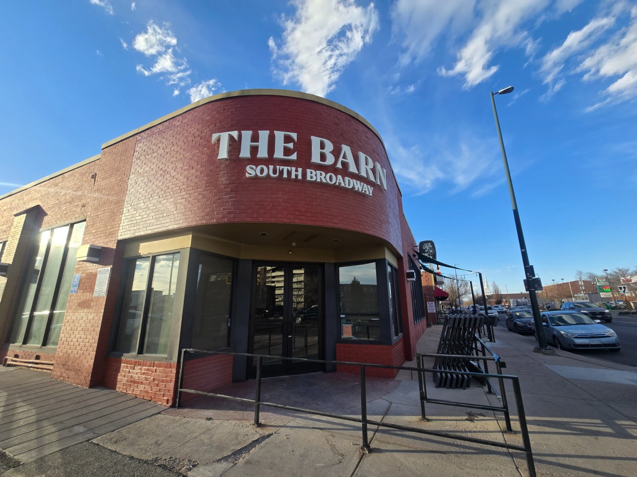 front of building with 'the barn" sign above door