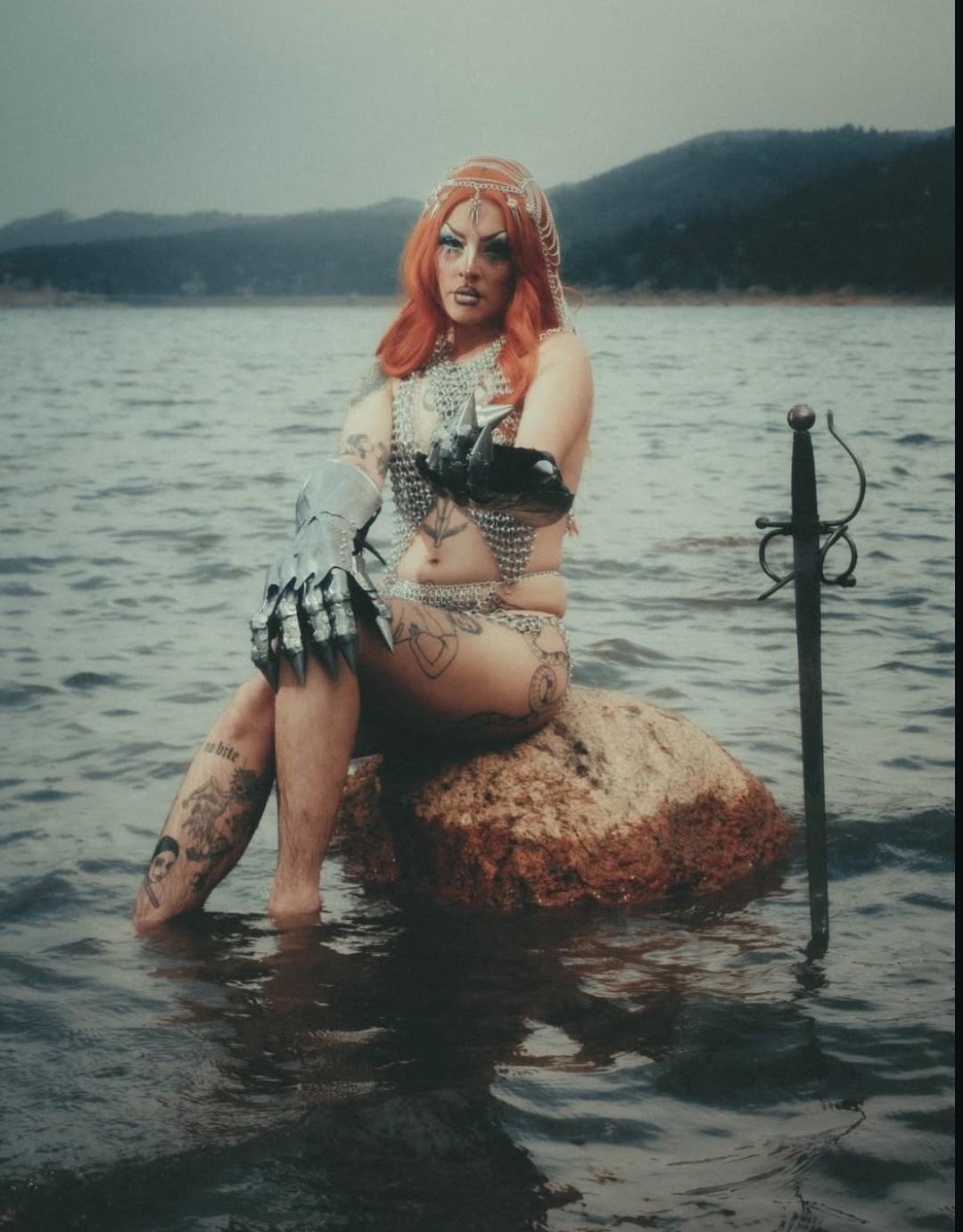 drag queen wearing chain mail