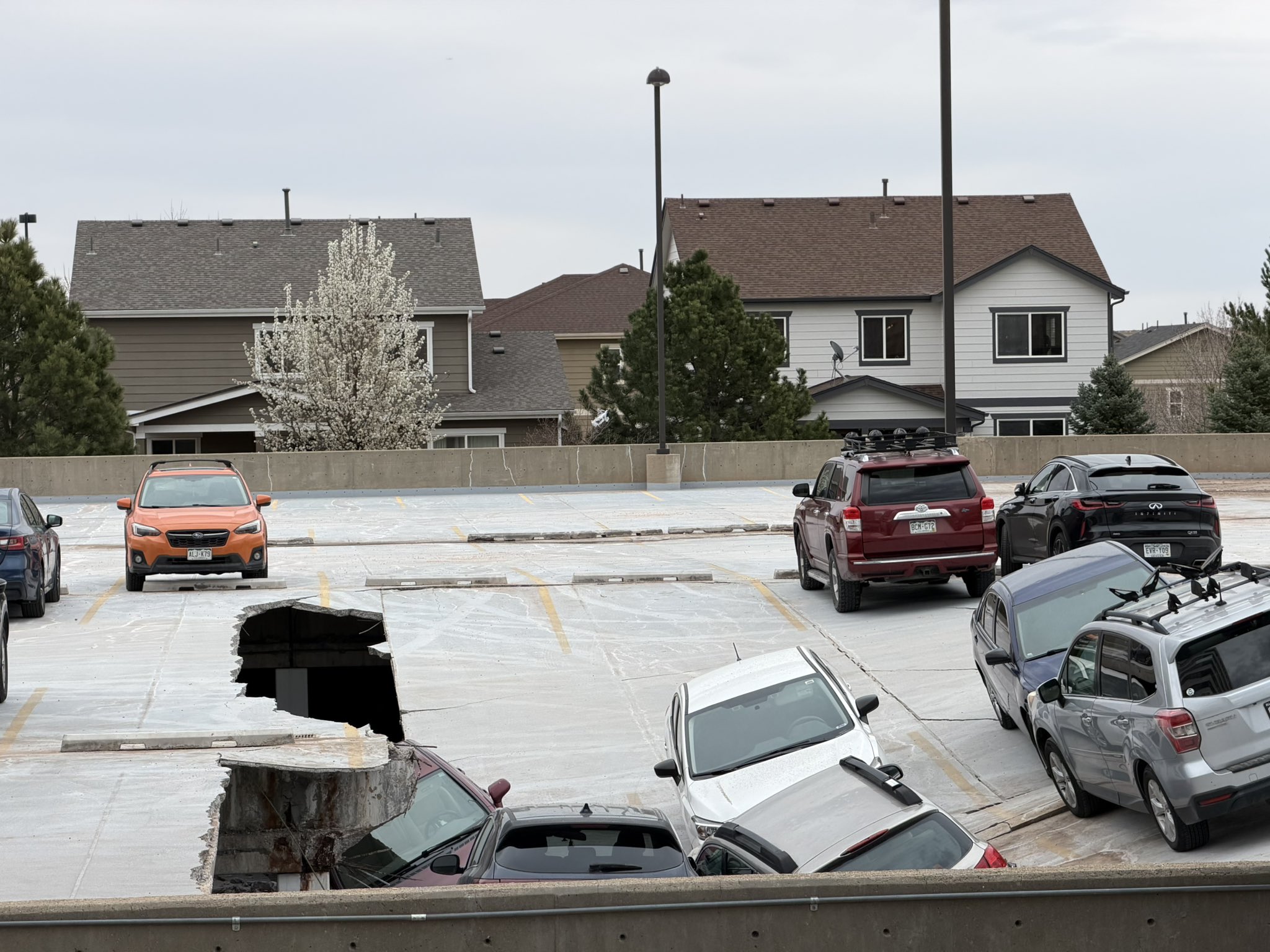 cars fall into a collapsed parking garage floor