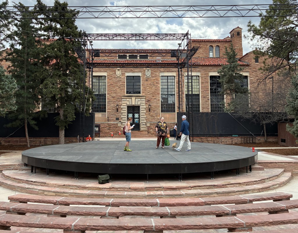 The Mary Rippon Outdoor Theatre with people and a dog on it