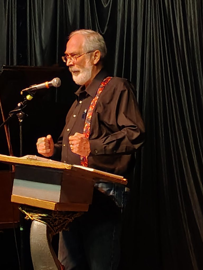 A man performs at an open mic