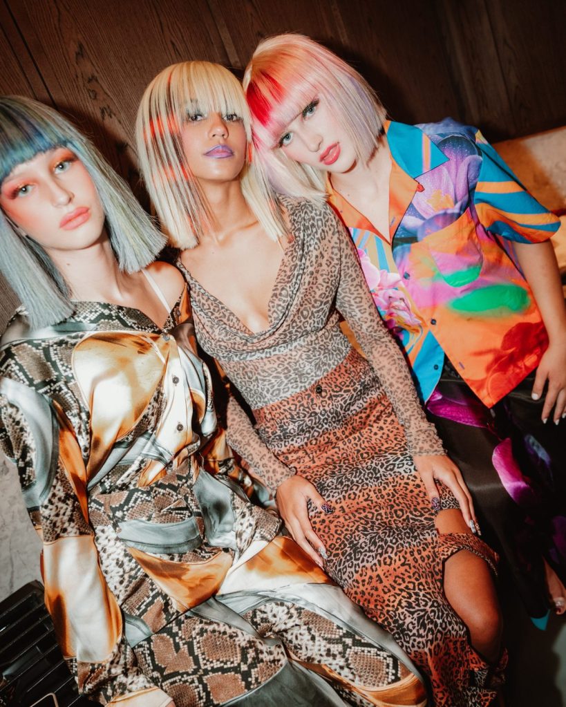 People with colorful hair and clothes