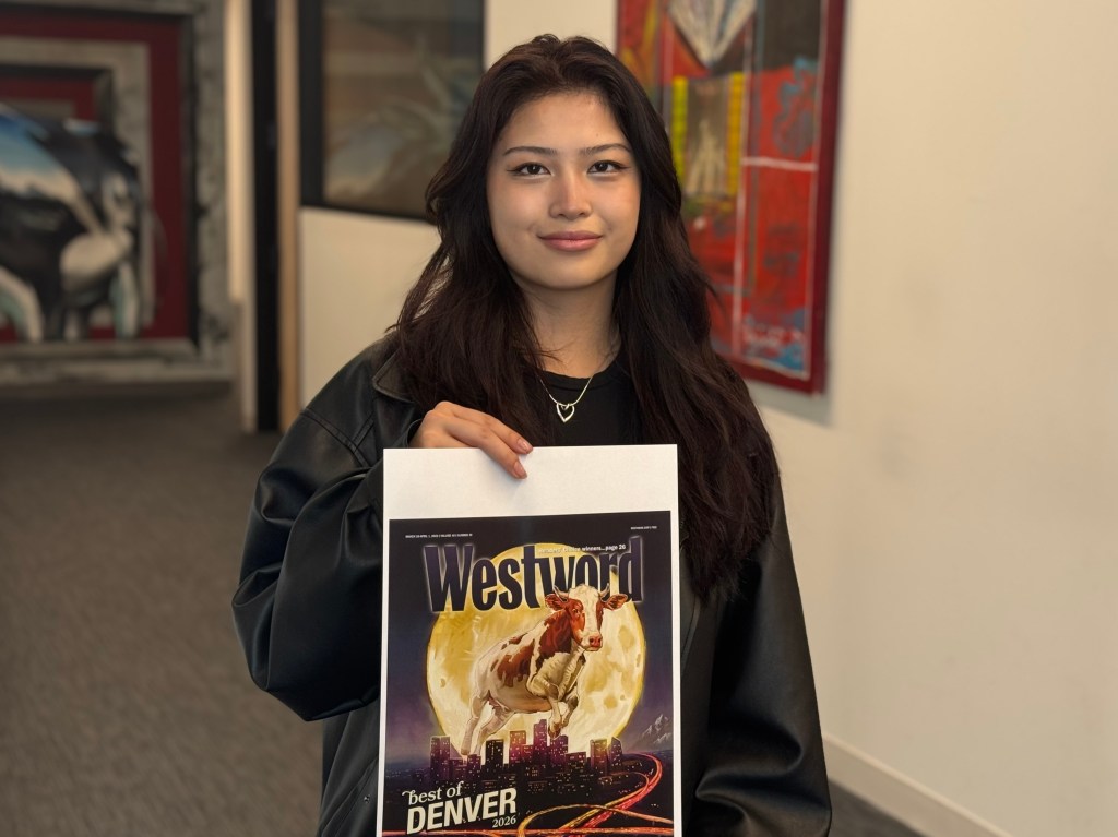 woman holding illustration she drew