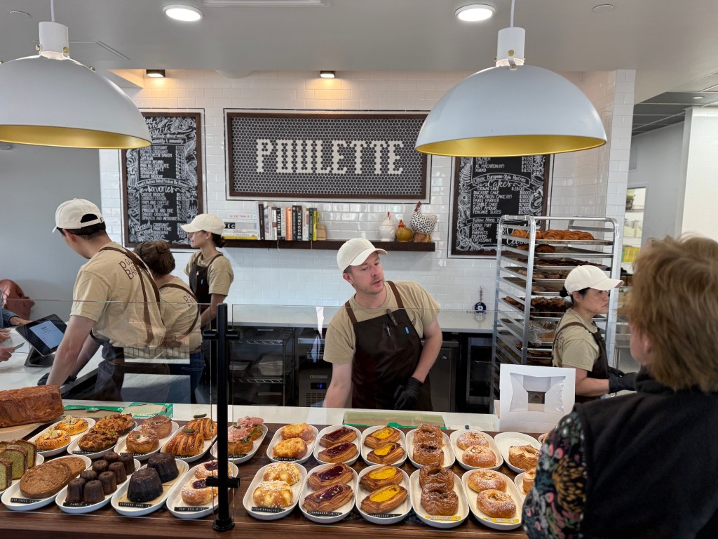 a man taking a pastry order