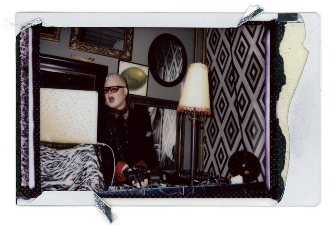 An instax photo of a person wearing black for Shadows Gather's "Nightcap" exhibition.