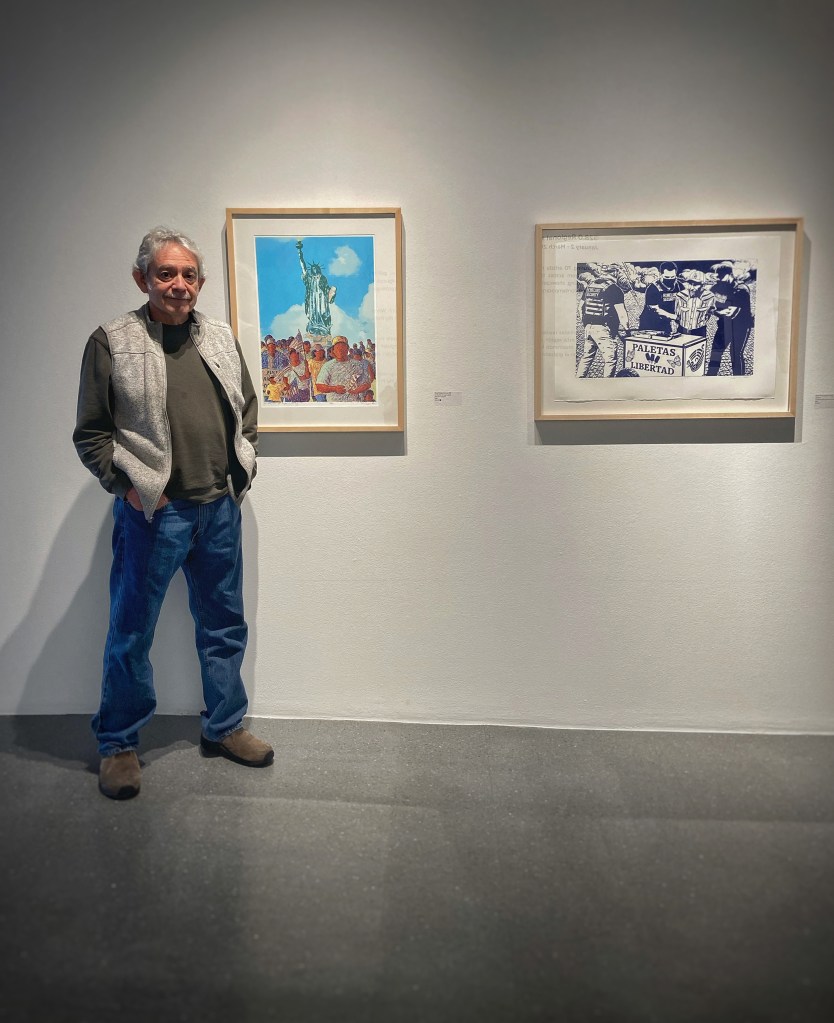 Tony Ortega with his artwork.