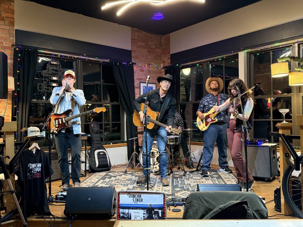 country band Flattop Rider performing in an indoor venue