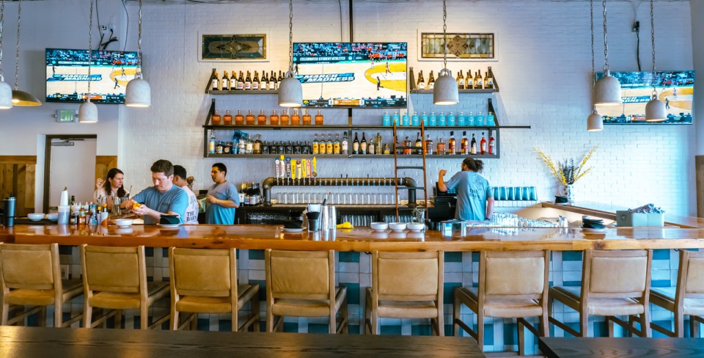 chairs lined up along a bar