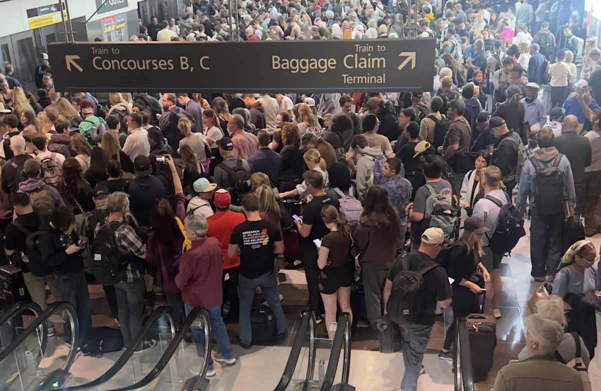 A crowded train concourse at Denver International Airport during a power outage