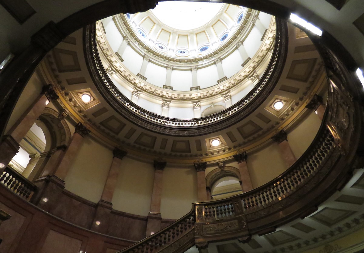 Light shines through the roof dome at the Colorado State Capitol building.