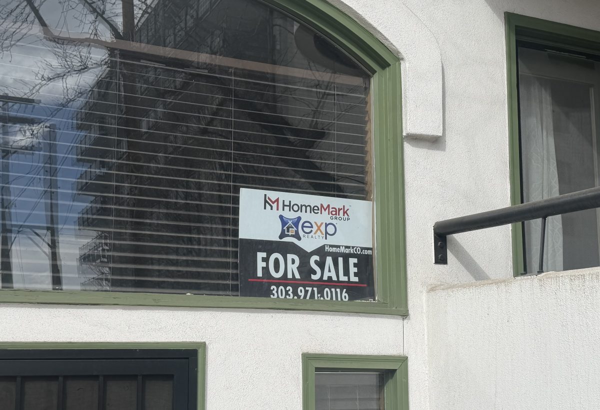 A window sign advertises a condo for sale in Denver's Capitol Hill neighborhood.