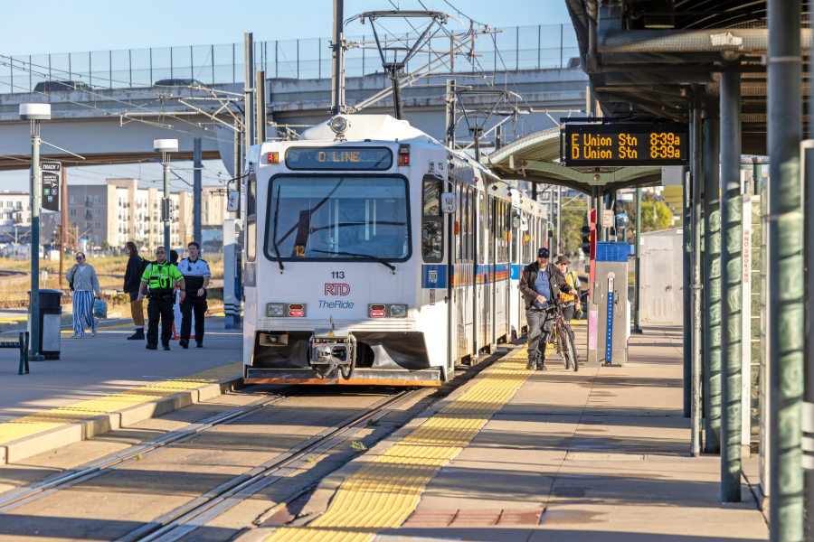The RTD D Line light rail stops to pick up passengers in Denver.
