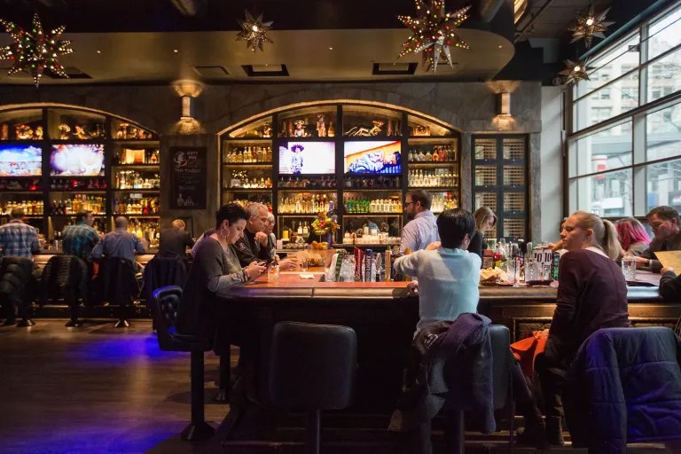 people sitting at bar