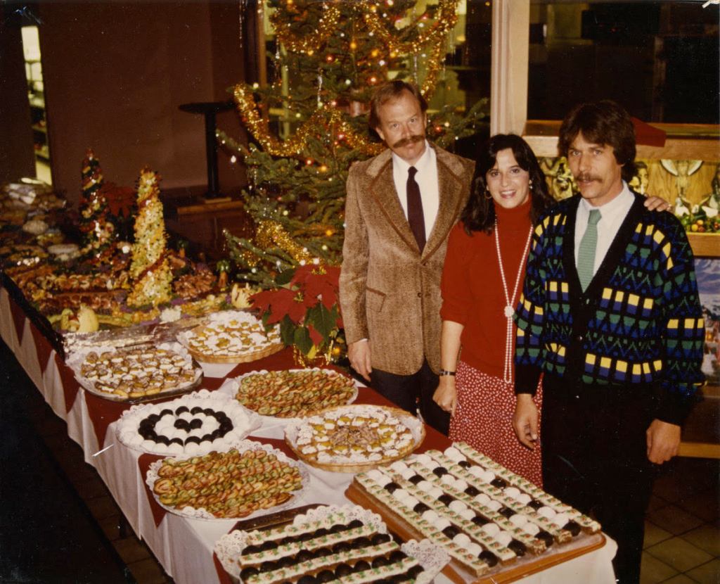 three partners at a restaurant's christmas party