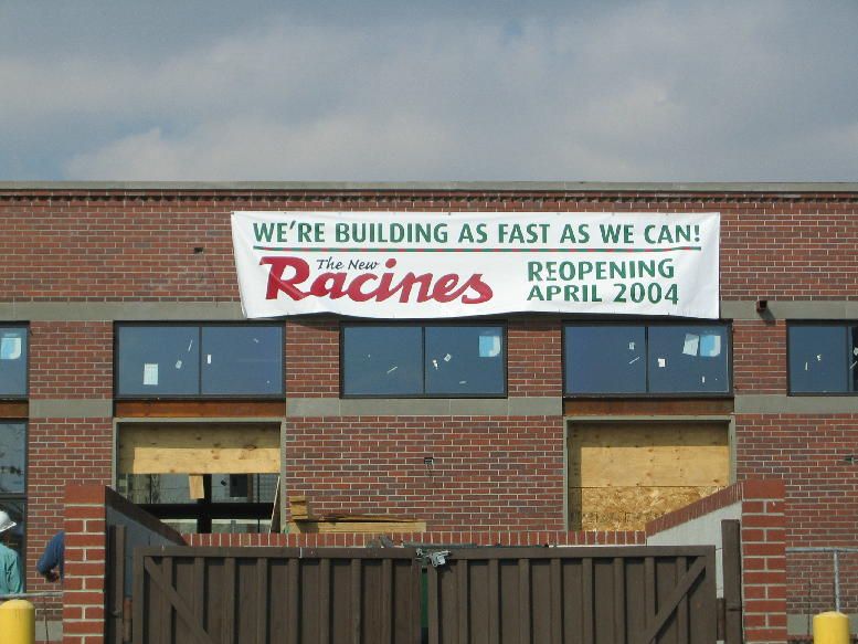 sign on building of a restaurant that's reopening.