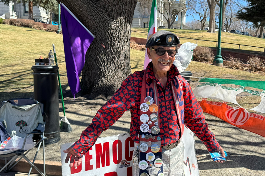 Iranian protester Roushan Kia stands in front of the Colorado State Capitol.