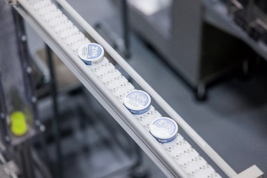 conveyor belts move zyn packages along in an Aurora factory