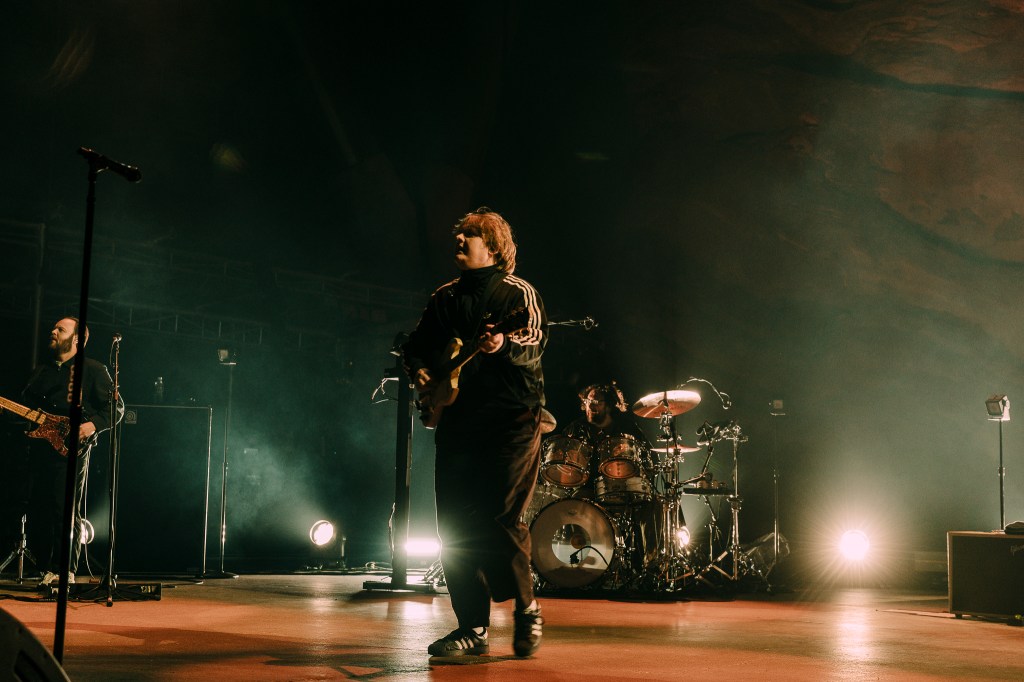 A photo of Lewis Capaldi performing on stage at Red Rocks.