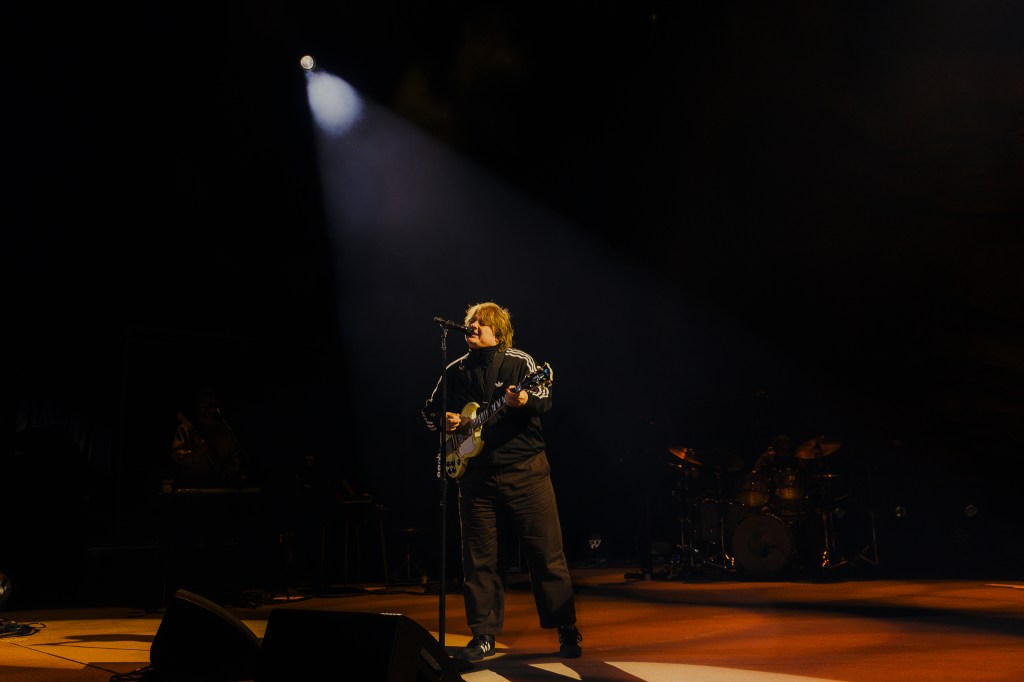A photo of Lewis Capaldi performing on stage at Red Rocks.