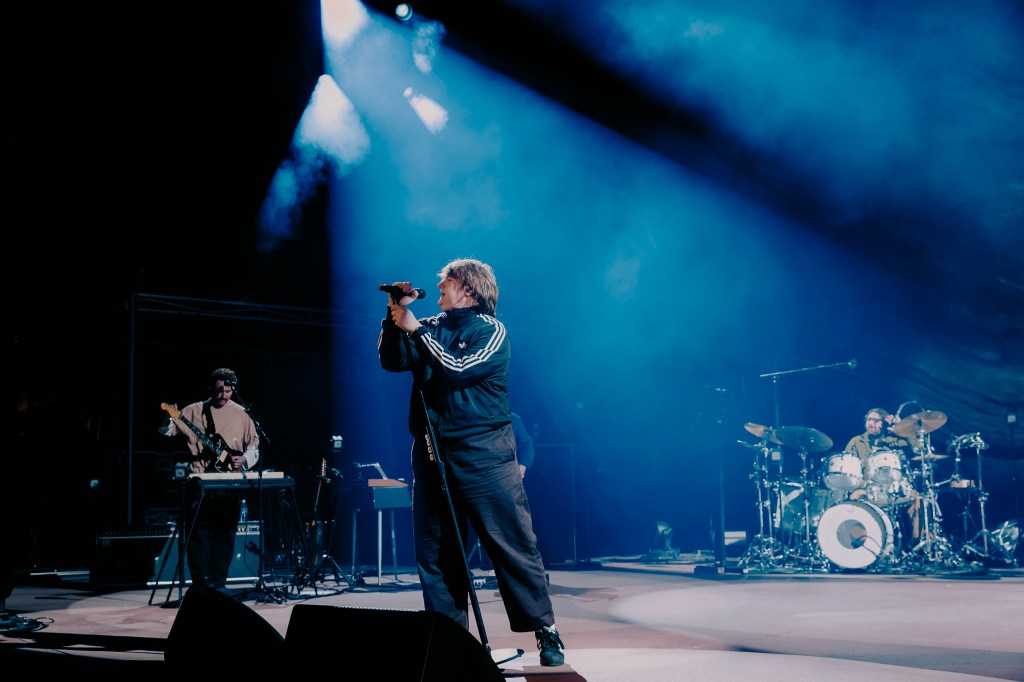 A photo of Lewis Capaldi performing on stage at Red Rocks.
