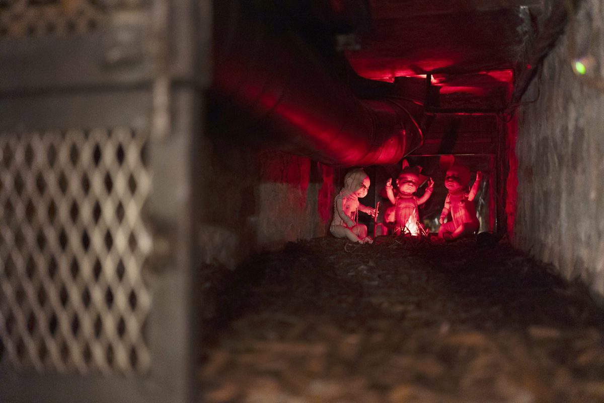demonic baby decorations inside of a haunted mansion