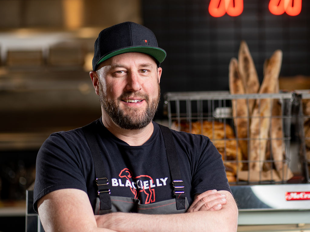 man in a black t-shirt and hat
