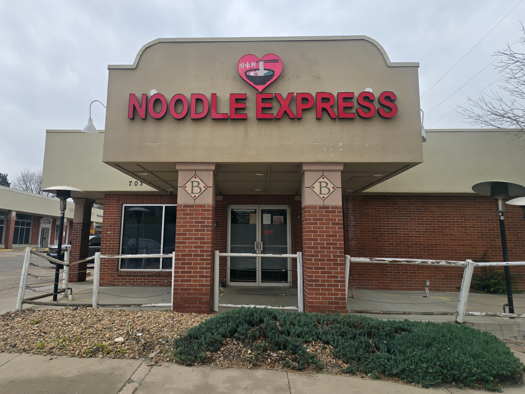building with a "Noodle Express" sign