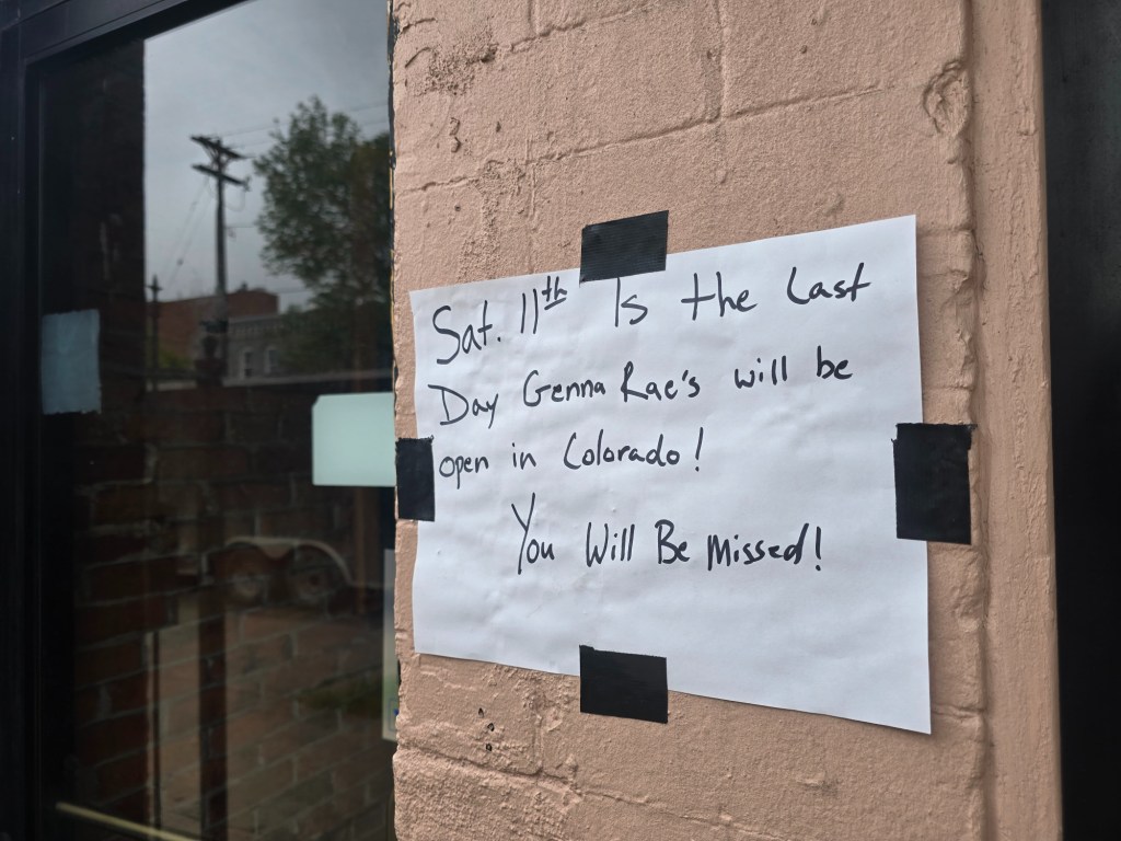 handwritten sign on a building