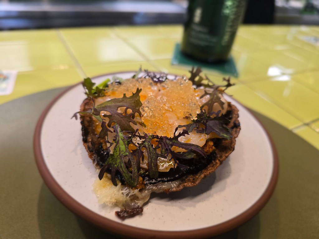 tortilla topped withv scallops on a plate