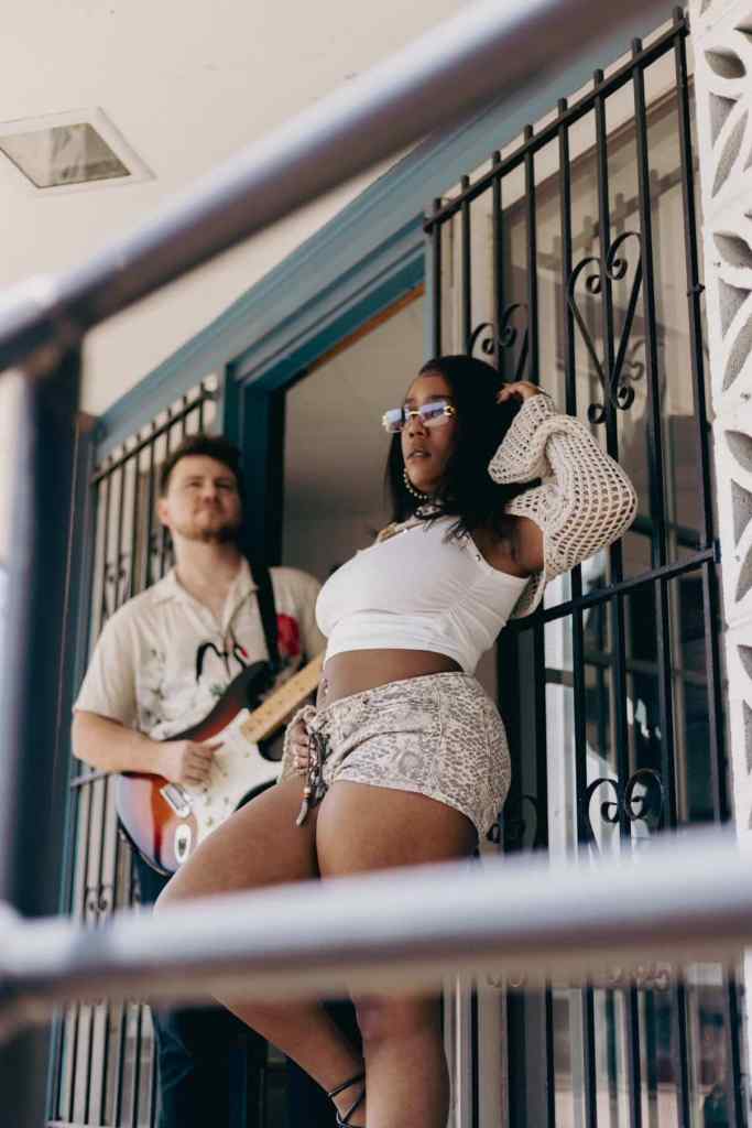 guitarist and singer on balcony