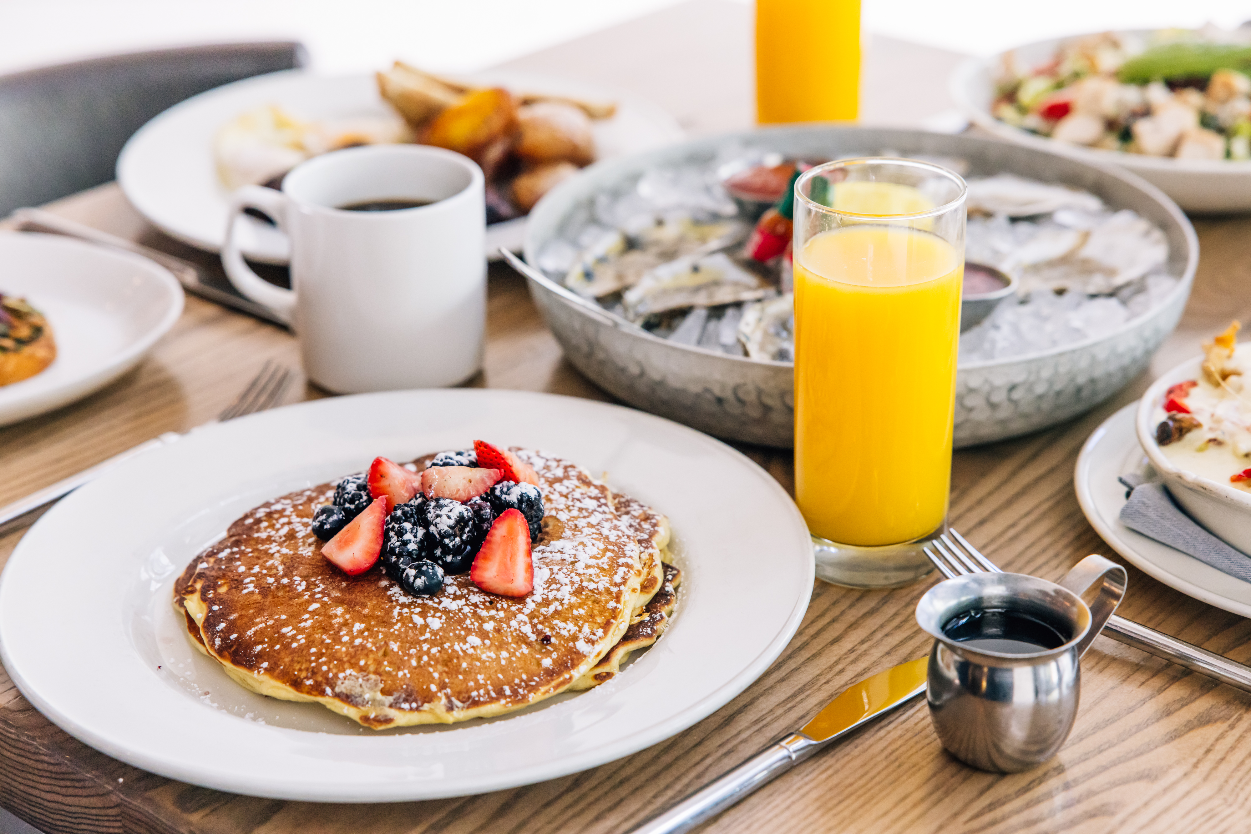 Berry pancakes, a mimosa and fresh oysters from Corinne's brunch menu