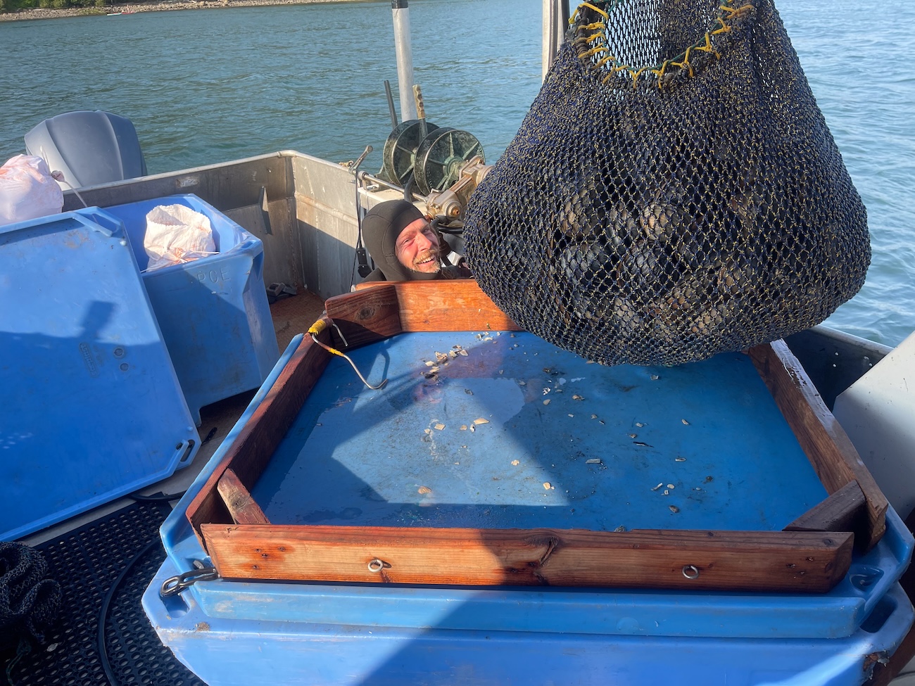 Craig Andes sits on his ship after an excavation dive