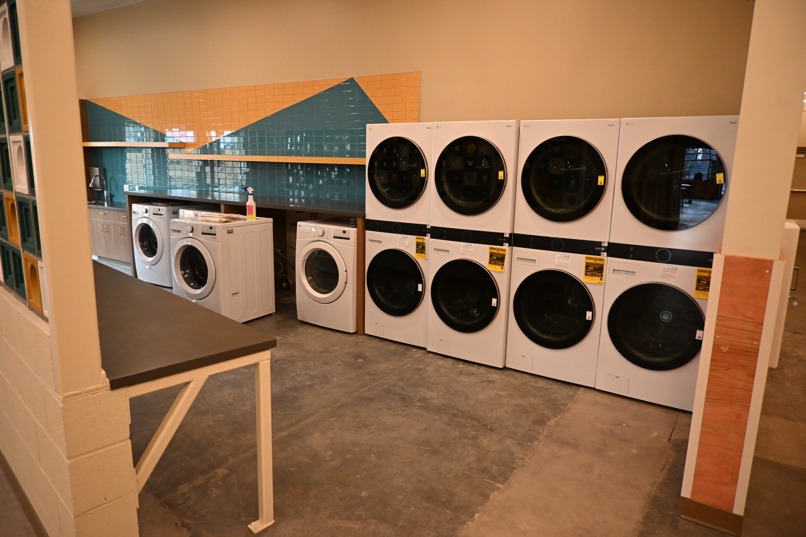 a row of washing machines inside the Lakewood Navigation Center