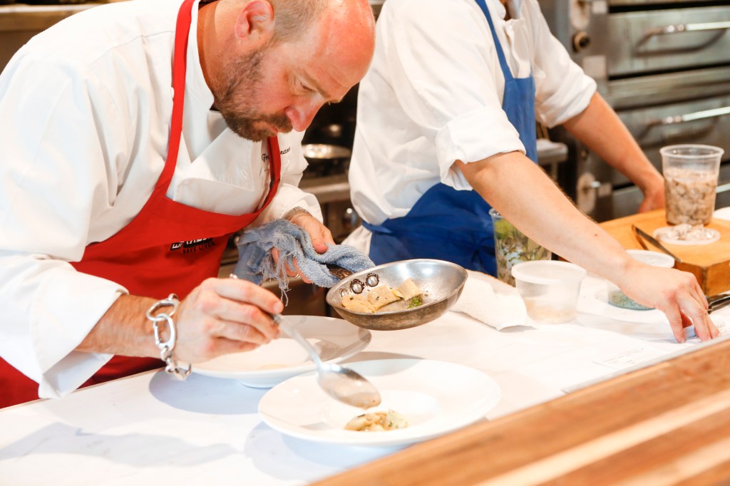 a chef plating food