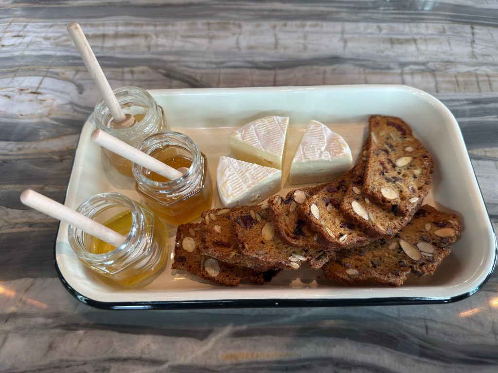 a plate of honey and cheese