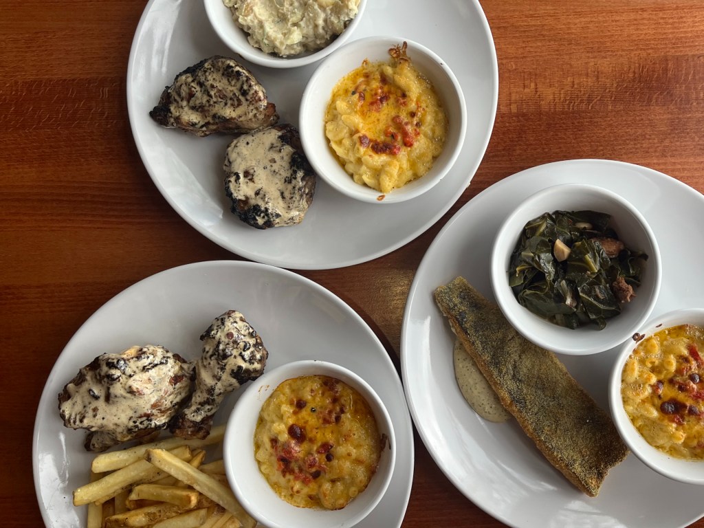 three plates with various food