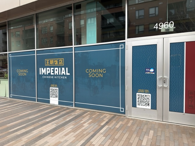 "coming soon' signage in a window