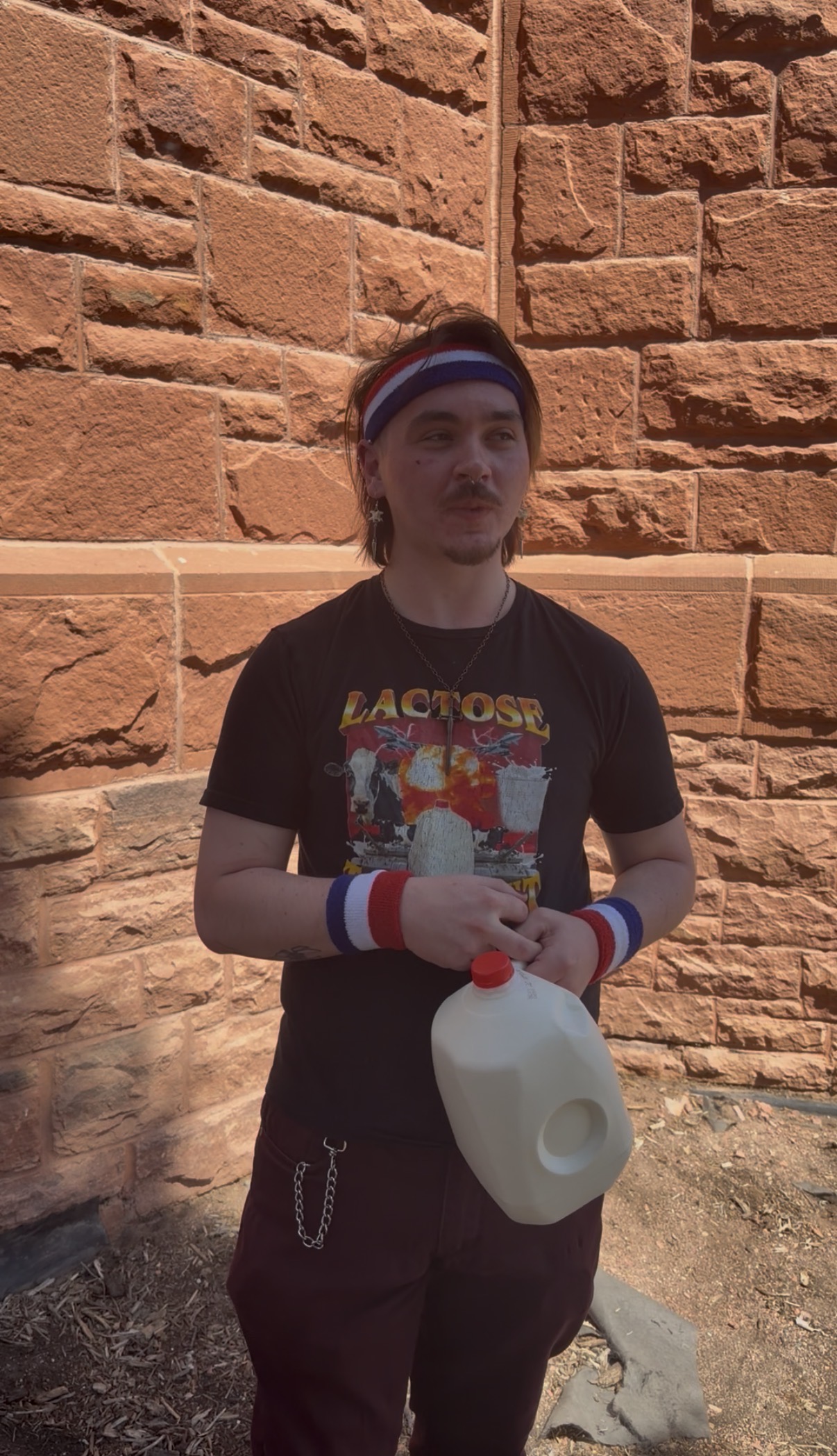 the bovine Baron gives an interview while holding a gallon of milk