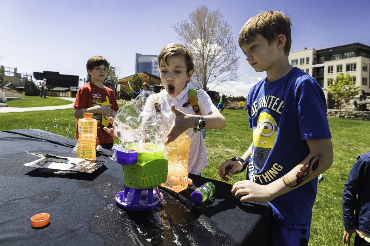 Kids play with bubbles at an event