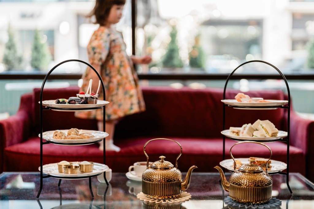 Gold teapots and tiered stands presented during afternoon tea at Local Jones