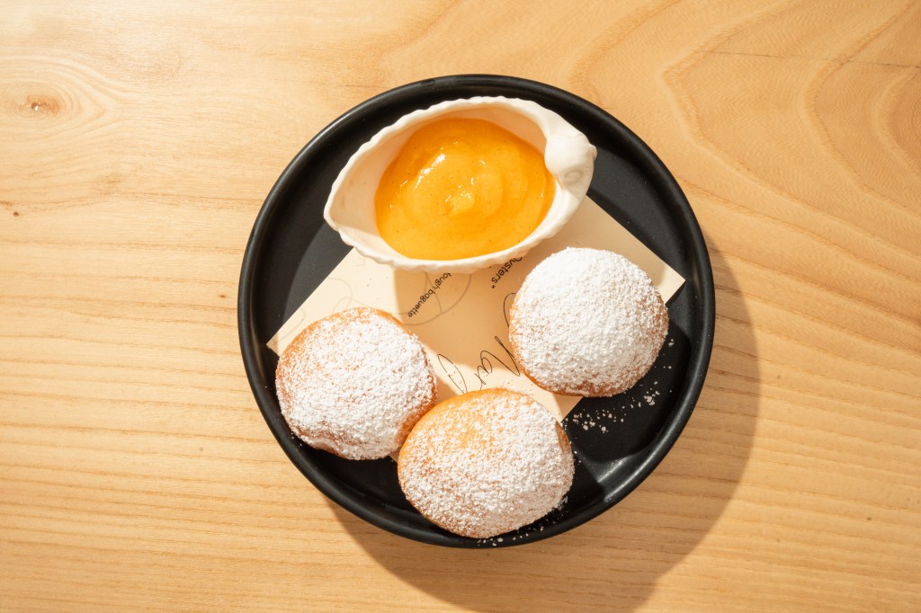 A plate of beignets and lemon curd from Margot's new brunch menu
