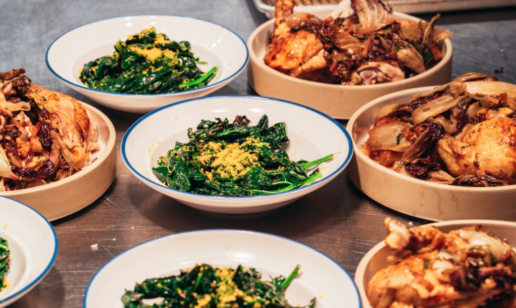 A table of chicken and vegetables.