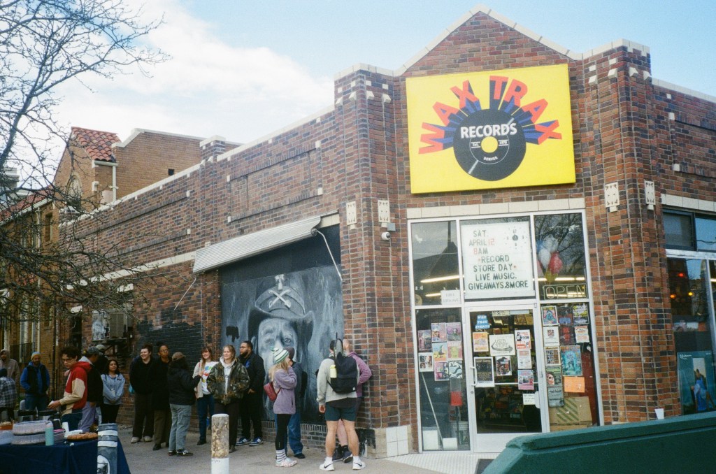 A line of people outside Wax Trax record store