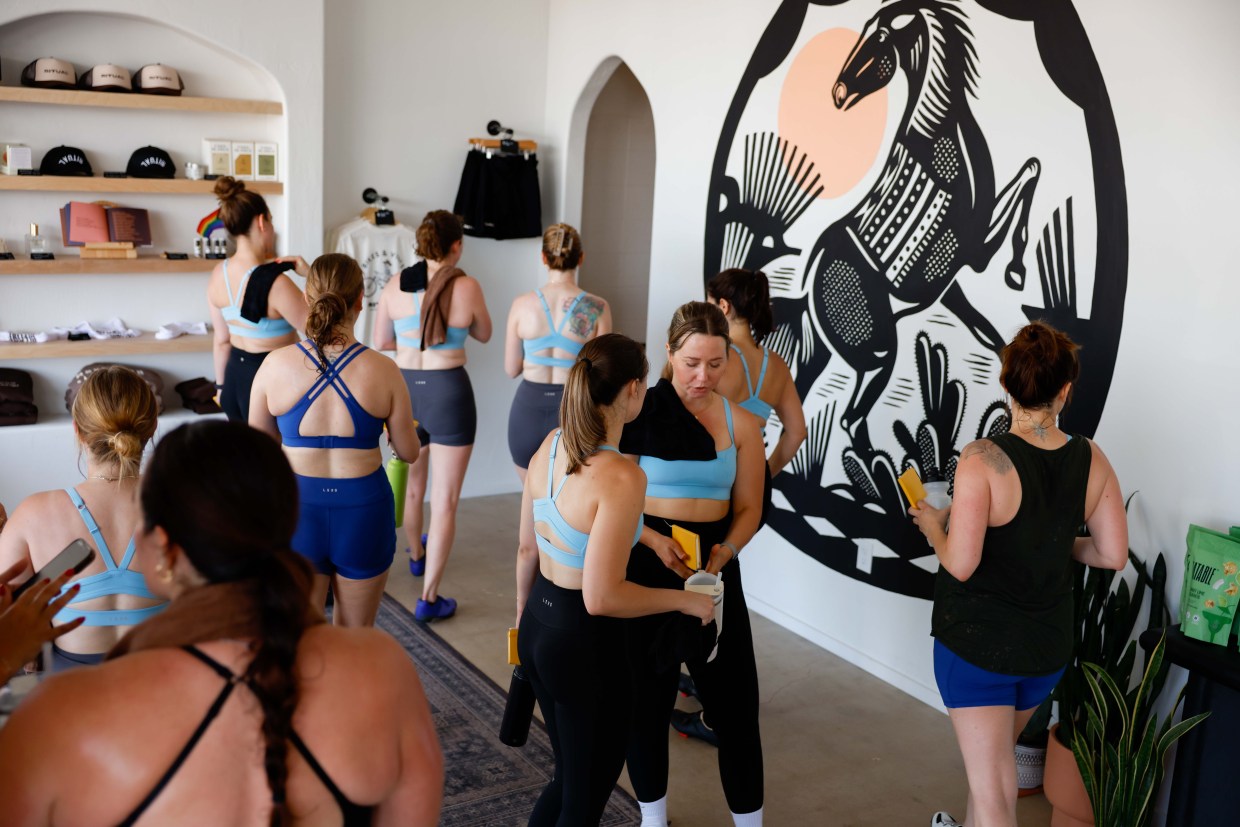 Women in matching athletic apparel in the Ritual lobby