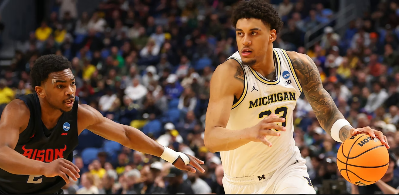 University of Michigan forward Yaxel Lendeborg drives against a defender