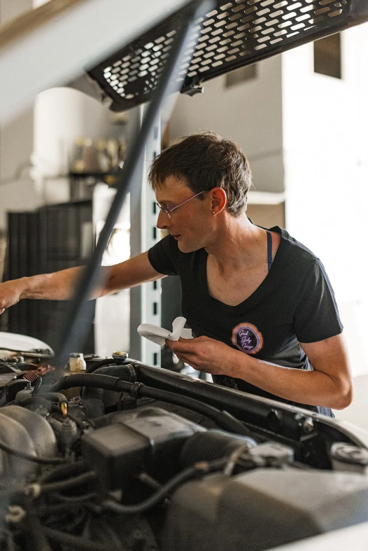 A person works on a car