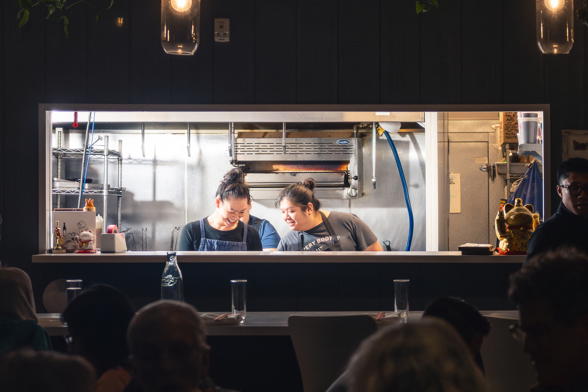two women working in a kitchen