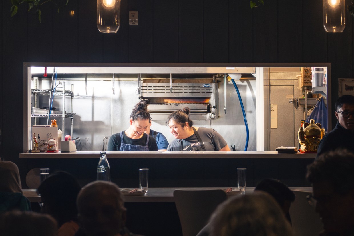 two women working in a kitchen