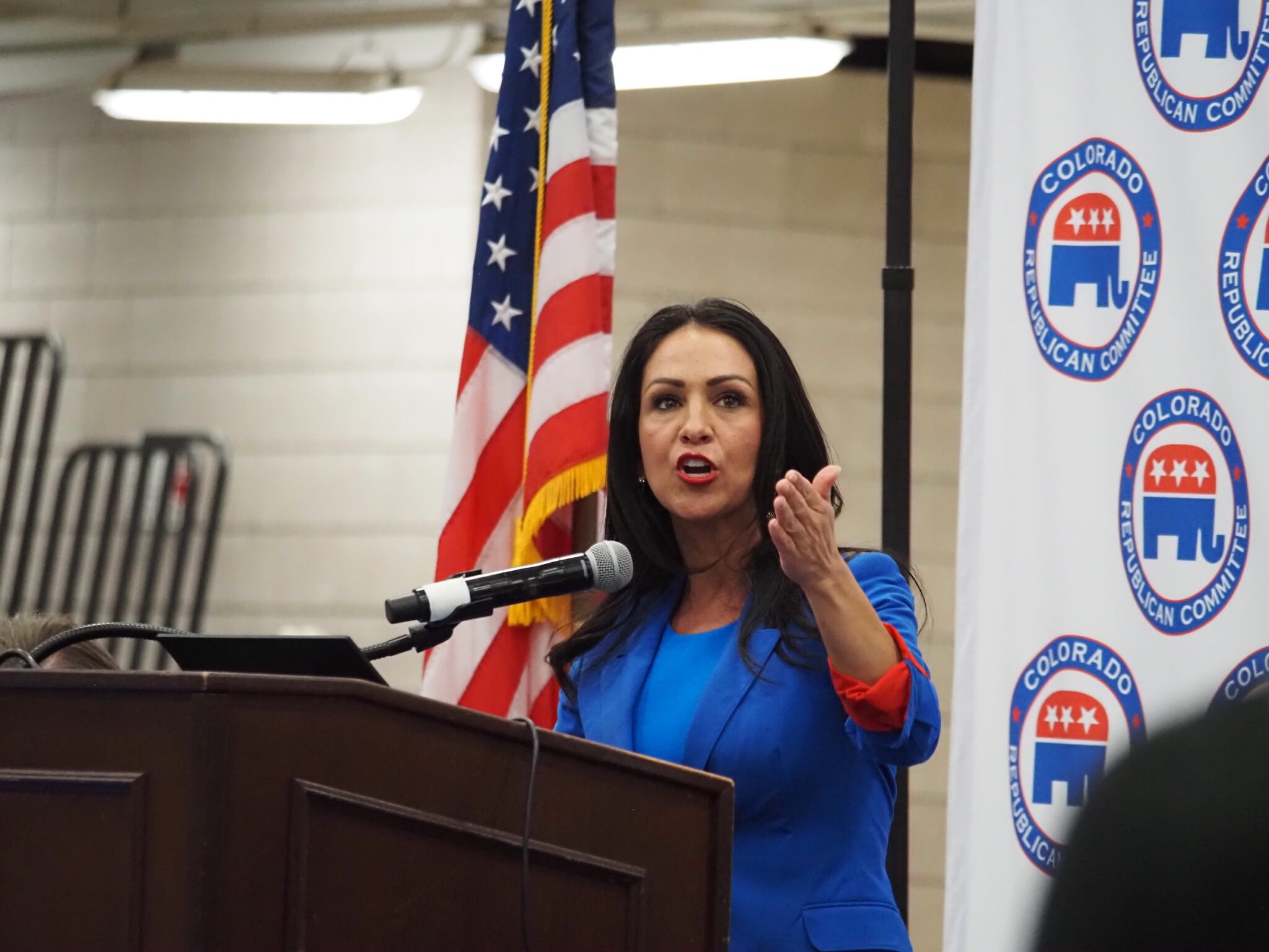 Lairen Boebert speaks at podium during Colorado Republican assembly