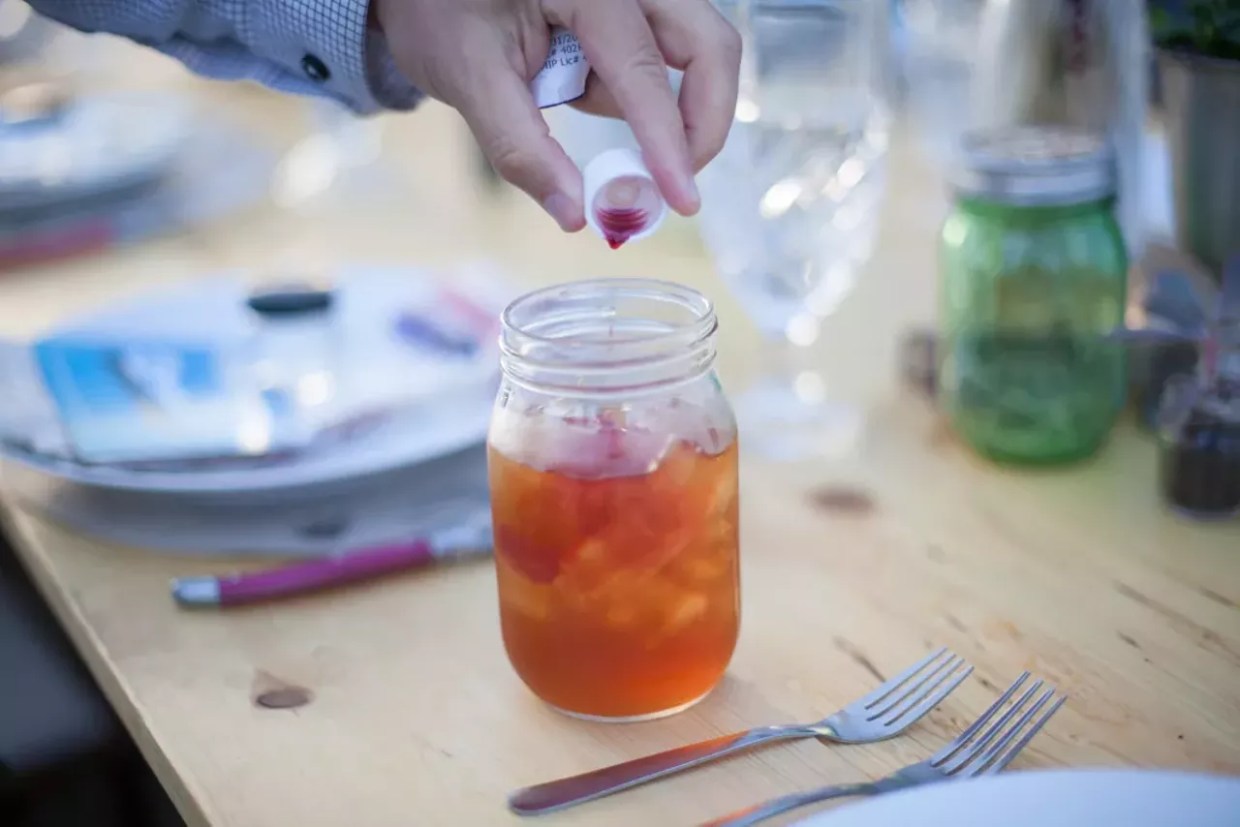 THC syrup is added to a drink before mixing